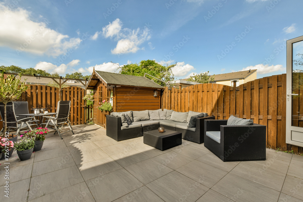 Cozy backyard patio with modern garden furniture Cozy backyard patio with modern garden furniture