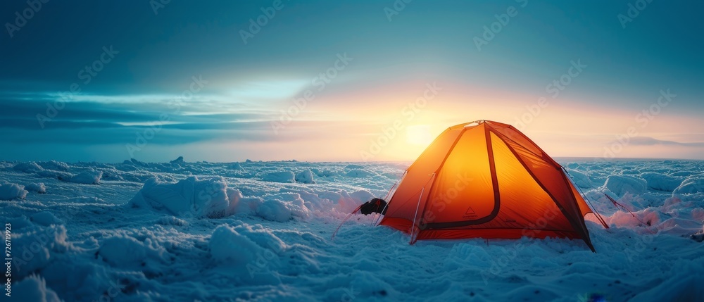 Glowing tent in a snowy Arctic landscape at dusk, showcasing serene yet harsh environment.