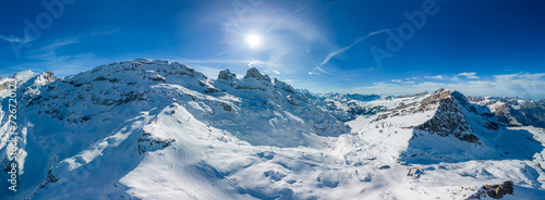 Aerial panoramic winter landscape in Swiss Alps, famous Engelgerg - Titlis ski resort, Switzerland © Martin Valigursky