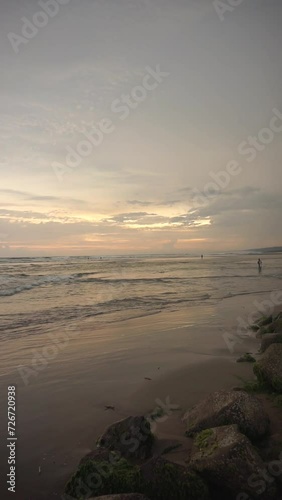 video of beautiful vertical evening beach view before sunset with small waves on Cipatujah Tasikmalaya beach photo