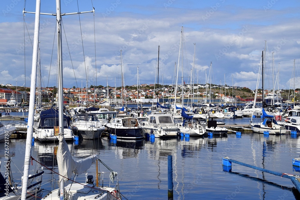 Modern water, summer, transport, yachts and boats, for recreation and fishing are moored in the harbor