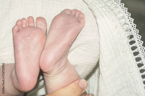 Children's little legs. Legs of a newborn baby. Baby's little fingers