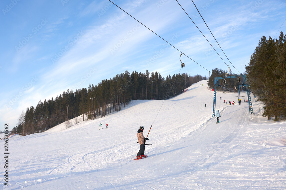 Ski season. Snow slope with T-bar and group of people. Panoramic view. Ski season. Snow slope with T-bar and group of people. Panoramic view.