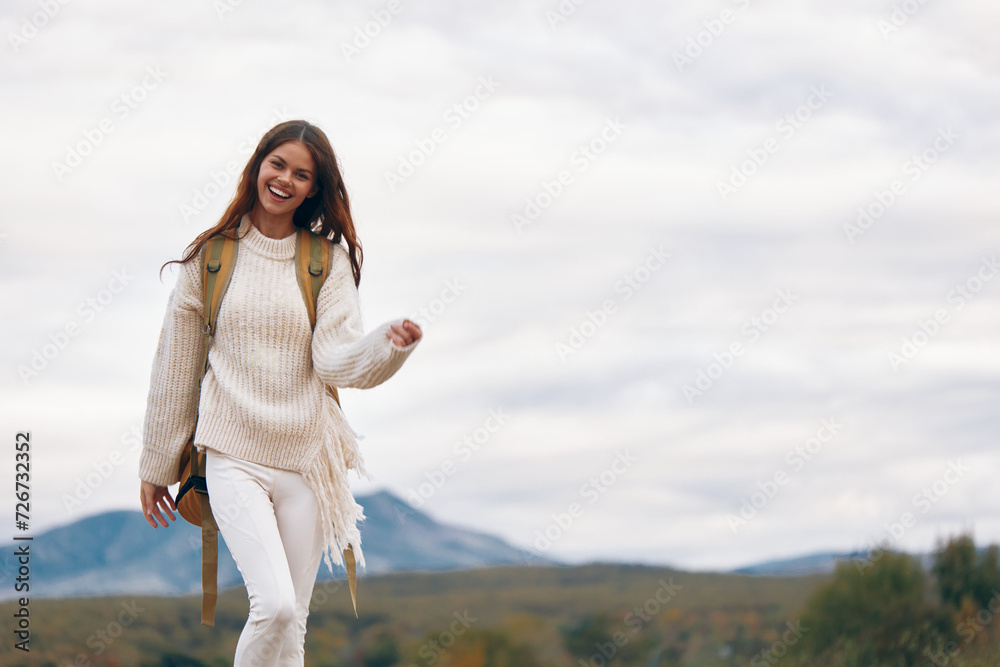 Mountain Adventure: Smiling Woman Climbing Cliff