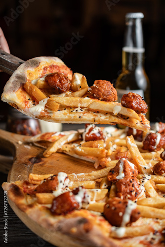 Pizza on wooden table photo