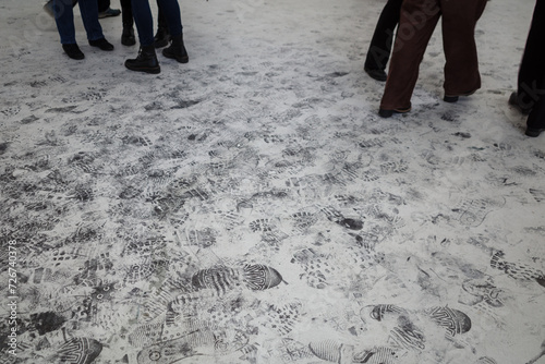 Slika na platnu Bustling city sidewalk, immortalizing the myriad footprints left by pedestrians