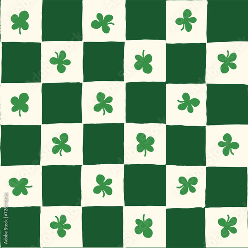 Seamless vector repeating pattern with hand drawn checkerboard in green and cream and a four leaf clover shamrock. St Patricks day lucky clover background.