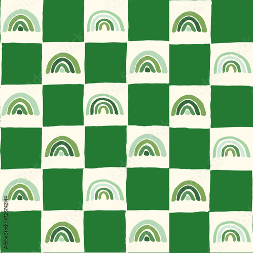 Seamless vector repeating pattern with hand drawn checkerboard in green and cream and a tonal green rainbow. St Patricks day rainbows background.