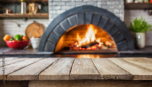 Empty table with blurred pizza oven background