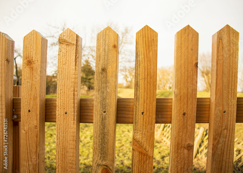 Brown wooden fence, rustic fence separating objects, close-up.