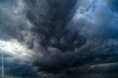 storm sky, dark dramatic clouds during thunderstorm, rain and wind, extreme weather, abstract background