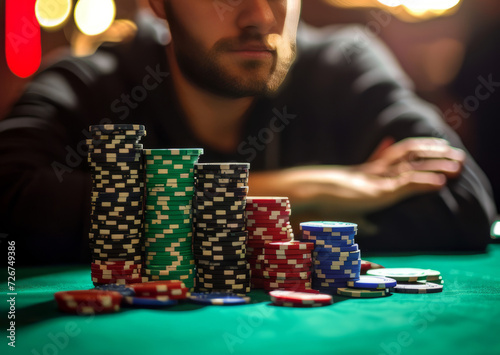 Professional Pokerplayer sitting at a table with chips