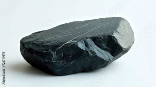 Polished Shungite stone with its lustrous black finish and powerful presence  set against a clean white backdrop