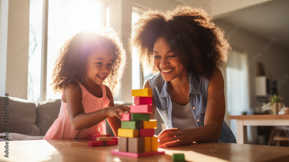 African American Mother and Daughter Building Colorful Wooden Block Towers at Home African American Mother and Daughter Building Colorful Wooden Block Towers at Home