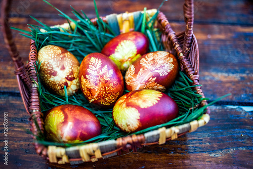 traditional Easter eggs in basket painted by boiling in red onion leaves - organic food