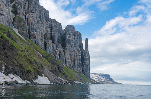 Massive Cliffs Rising From an Acrtic Shoreline photo