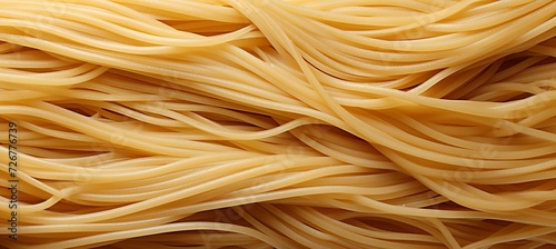 Top view close up of traditional italian pennettine pasta as abstract background texture