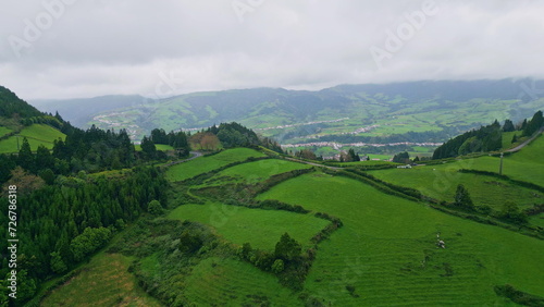 Drone greenery slopes thunder clouds nature. Green mountain hills environment