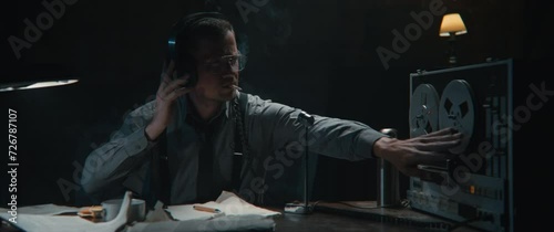 An intelligence officer write down his findings