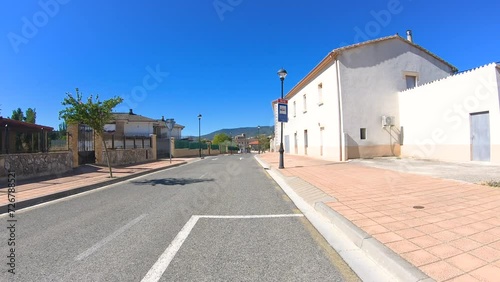 a paved road passing through Villatuerta, Navarre, Spain photo