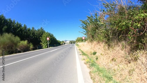NA-1110 paved road passing through Villatuerta, Navarre, Spain photo