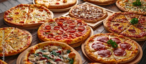 Variety of pizza with various fillings presented on a wood tray.