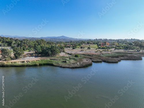 Aerial view over water reservoir and a large dam that holds water. Rancho Santa Fe in San Diego  California  USA