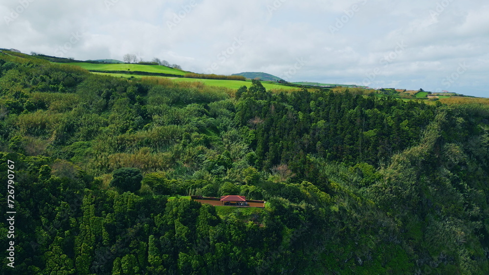 Aerial peaceful green hills summer day. Lush forest mountain slopes landscape
