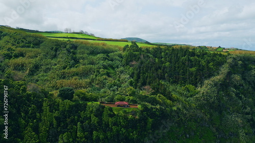 Aerial peaceful green hills summer day. Lush forest mountain slopes landscape