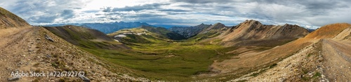 Mountain tundra valley with sheep and dramatic clouds © Charles Baden