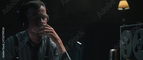 An intelligence officer is working at the wiretap station 