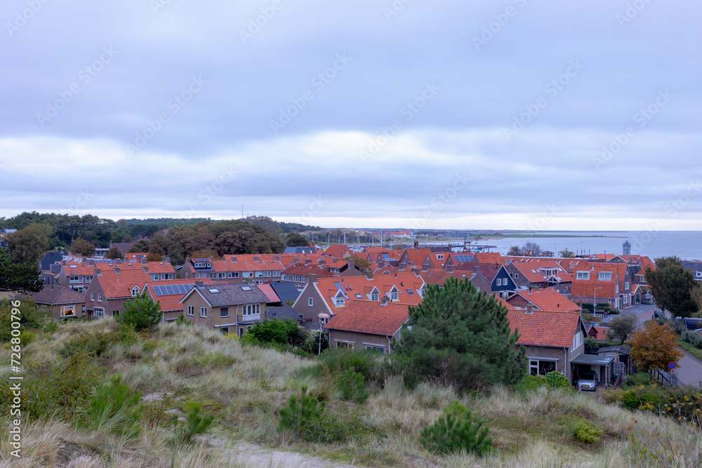 Viewpoint view with small town villages in West-Terschelling with habor, The Dutch Wadden Sea island Terschelling in the evening, A municipality and an island in the northern, Friesland, Netherlands.