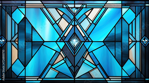 Geometric Art Deco style stained glass window in many shades of blue.