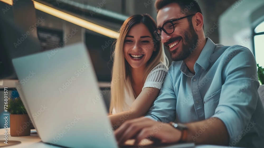 Cheerful businesspeople using a laptop in an office. Happy young entrepreneurs smiling while working together in a modern workspace. Two young businesspeople sitting together at a tabl : Generative AI Cheerful businesspeople using a laptop in an office. Happy young entrepreneurs smiling while working together in a modern workspace. Two young businesspeople sitting together at a tabl : Generative AI