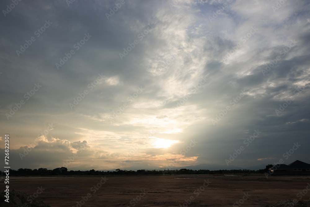 Sky during overcast, storm at evening. Include many gray clouds, empty space, light nature, sunset sunrise, horizon skyline, land or landscape at outdoor for background. Concept of disaster, danger. Sky during overcast, storm at evening. Include many gray clouds, empty space, light nature, sunset sunrise, horizon skyline, land or landscape at outdoor for background. Concept of disaster, danger.