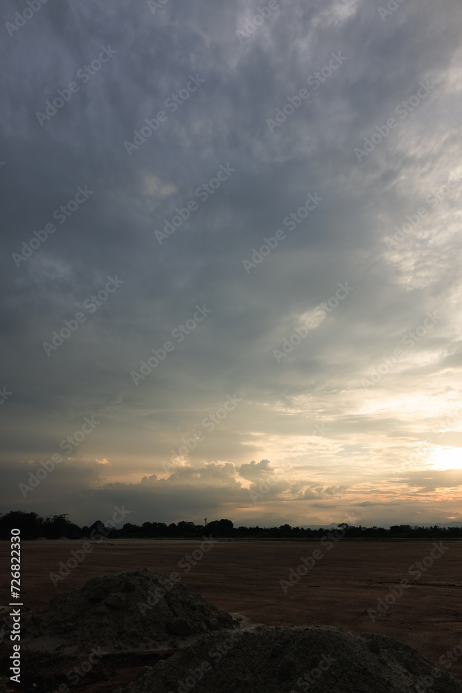 Obraz premium Sky during overcast, storm at evening. Include many gray clouds, empty space, light nature, sunset sunrise, horizon skyline, land or landscape at outdoor for background. Concept of disaster, danger.