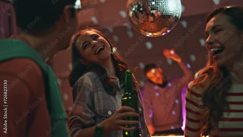 People enjoy disco party at home close up. Excited friends dancing together 