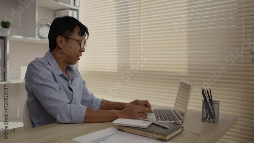 Man using laptop, Hand pressing on laptop keyboard, Work from the comfort of home, Work from home.