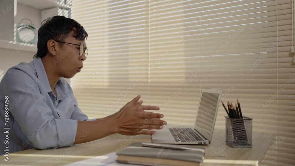 Man working from Home, Video call with customers on laptop, Remote Business Communication, Telecommuting Professional, Virtual Video Call with Office Customer, Work from Home Concept. Man working from Home, Video call with customers on laptop, Remote Business Communication, Telecommuting Professional, Virtual Video Call with Office Customer, Work from Home Concept.