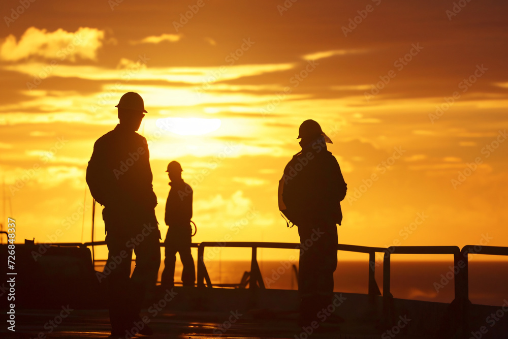 Obraz premium photo construction workers at sunset