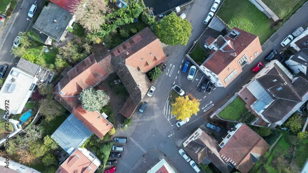 Top down aerial drone shot flying along a typical street in Heidelberg. Cars, people and cycles can be seen below. 4K Shot in Autumn, Germany Top down aerial drone shot flying along a typical street in Heidelberg. Cars, people and cycles can be seen below. 4K Shot in Autumn, Germany