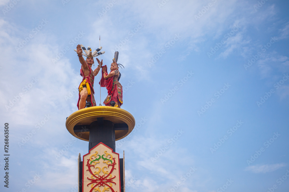 Mahir Mahar Monument, a monument honoring the local hero of Palangkaraya. The monument depicts a pair of traditional dancers with various ornaments typical of Central Kalimantan, Indonesia.