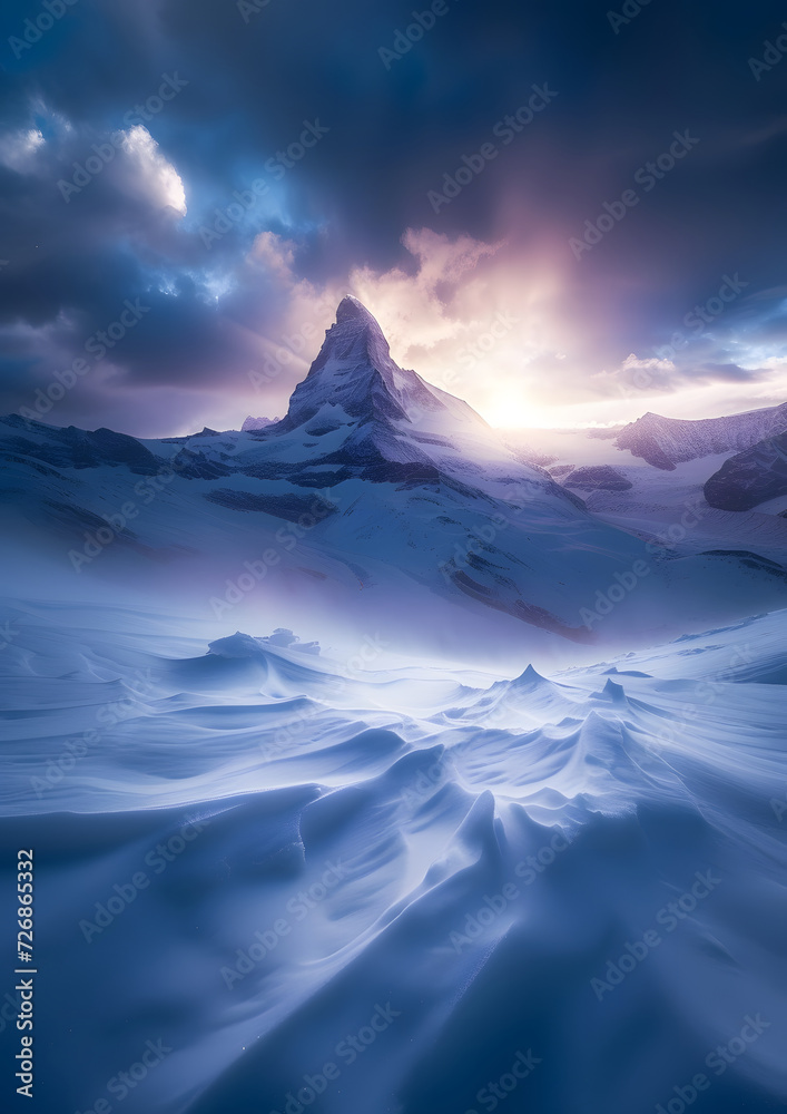 A snow covered mountain during incredible winds at its peak. Snow is blowing from its top,