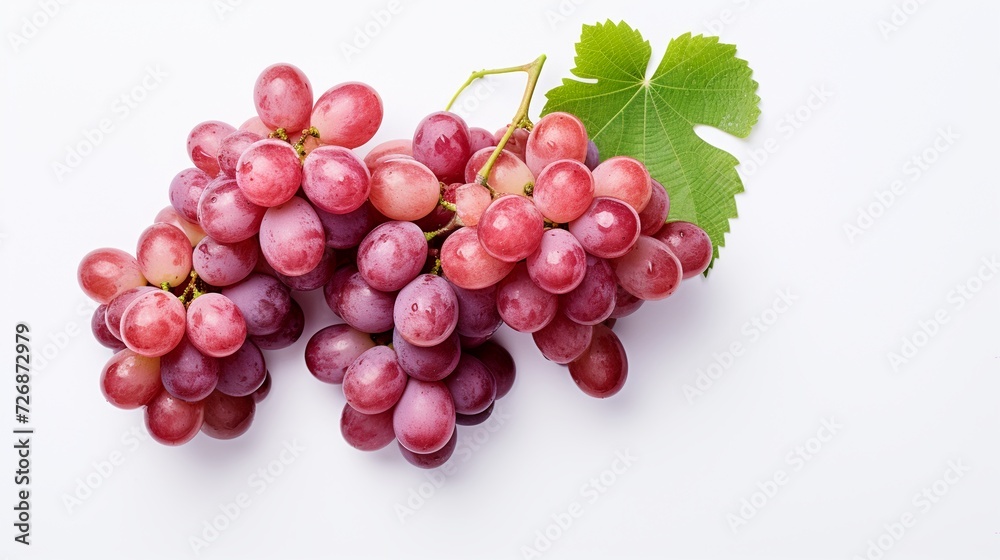 red grapes with green leaves on white background