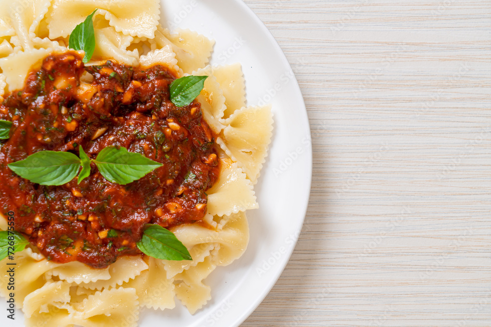 farfalle pasta with basil and garlic in tomato sauce farfalle pasta with basil and garlic in tomato sauce