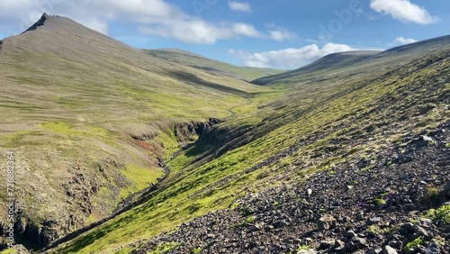 Hiking in Iceland in spring on Akrafjall mountain on a sunny day photo