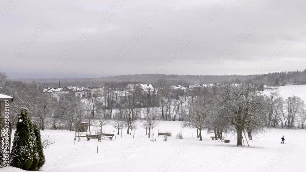 Lille Kid Happily Pulling Sled In Distance On Bright Snowy Day, 4K Lille Kid Happily Pulling Sled In Distance On Bright Snowy Day, 4K