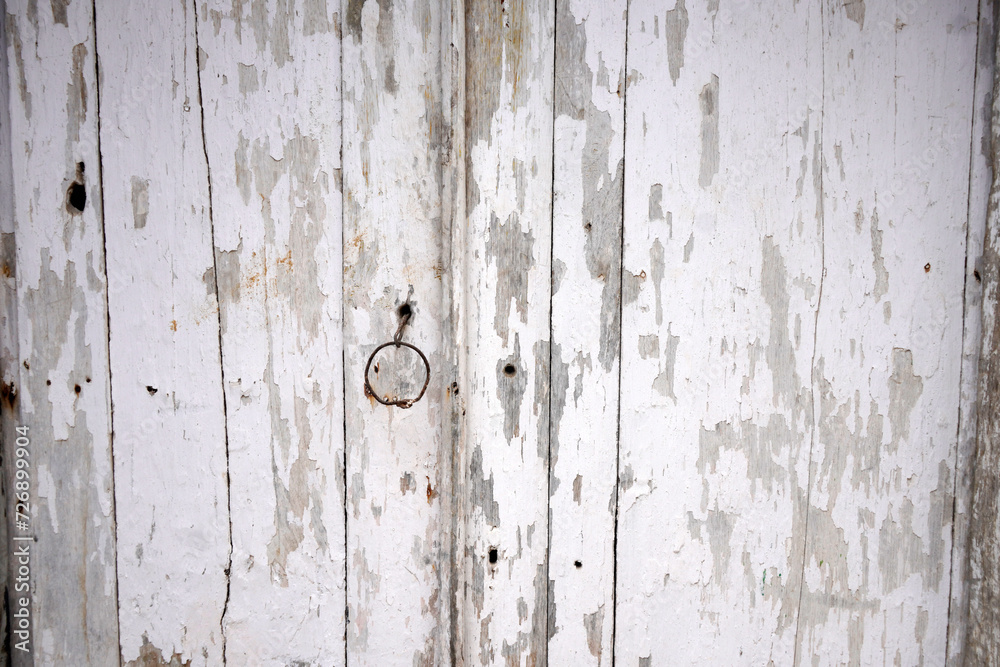 Texture of old wooden door with peeling and weathered paint, peeling gray paint. vintage wood background texture
Texture of old wooden door with peeling and weathered paint, peeling gray paint. vintage wood background texture