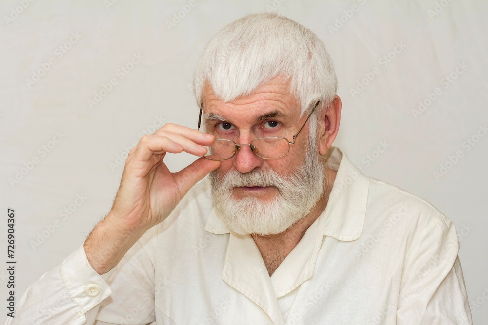 portrait of an elderly man with a gray beard portrait of an elderly man with a gray beard