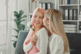 LGBT lesbian couple love moments happiness concept, Smiling young lesbian couple, lesbian couple embracing in the living room, Female couple enjoying time together in the house.